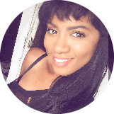 selfie of a woman with black hair in a black top