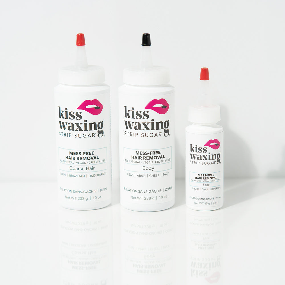 All three bottles of kiss waxing strip sugar hair removal product, "facia", "body", and "coarse hair" on a white background
