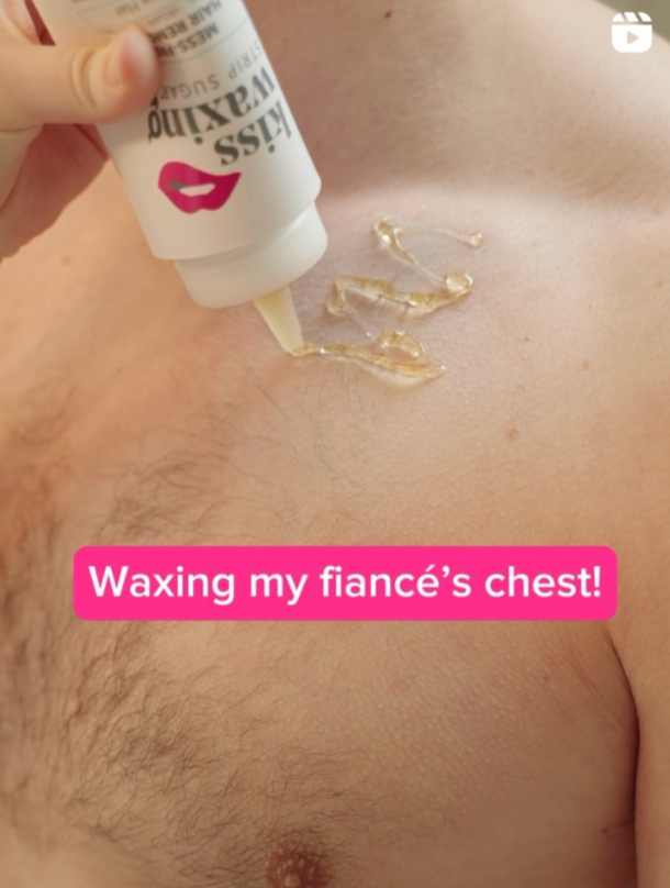 Person applying Kiss Waxing strips sugar to a chest and text 'Waxing my fiancé's chest!'.