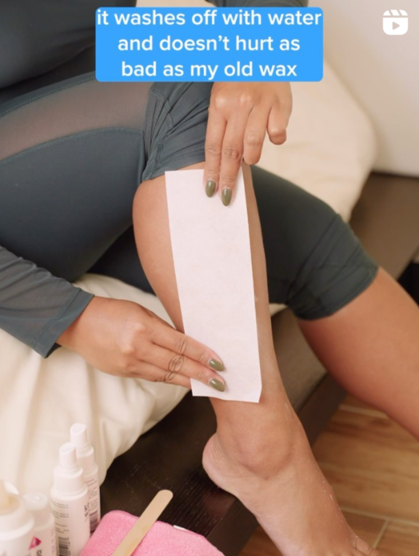 Person applying a strip to their leg with text indicating it washes off with water.