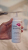 video of a person using kiss waxing strip sugar to remove unwanted hair from their eyebrows